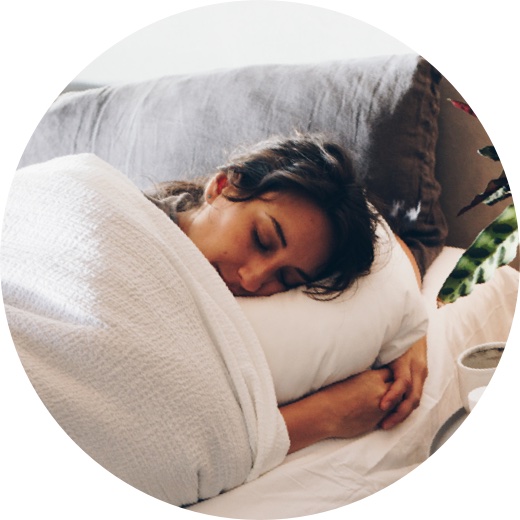 Woman sleeping soundly in bed after insomnia treatment