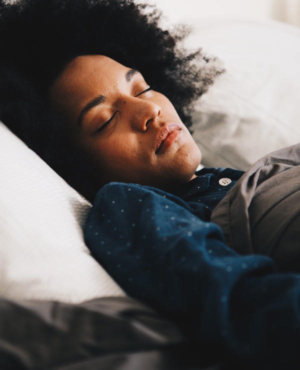 Woman sleeping
soundly in her bed