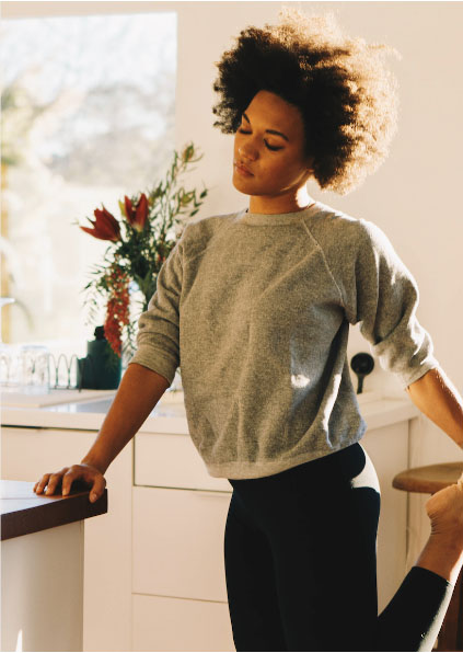 woman doing morning stretches after restful night
          of sleep