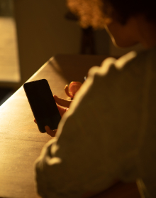 Woman checking in with her Kick sleep doctor from her phone