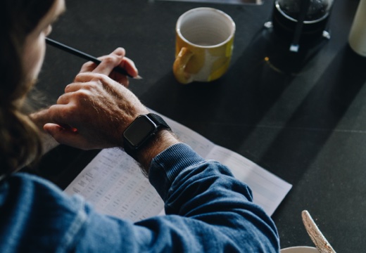 Man checking
the sleep data on his Apple watch to add into his Kick sleep
journal
